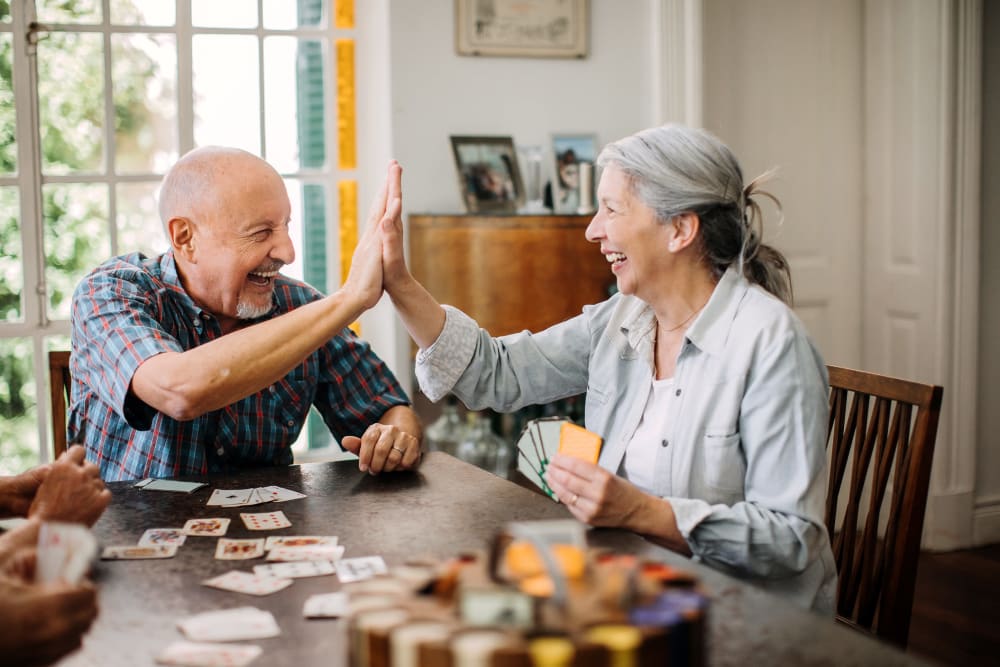 Resident couple enjoying a card game at Windsor House at Parkside in Columbiana, Ohio