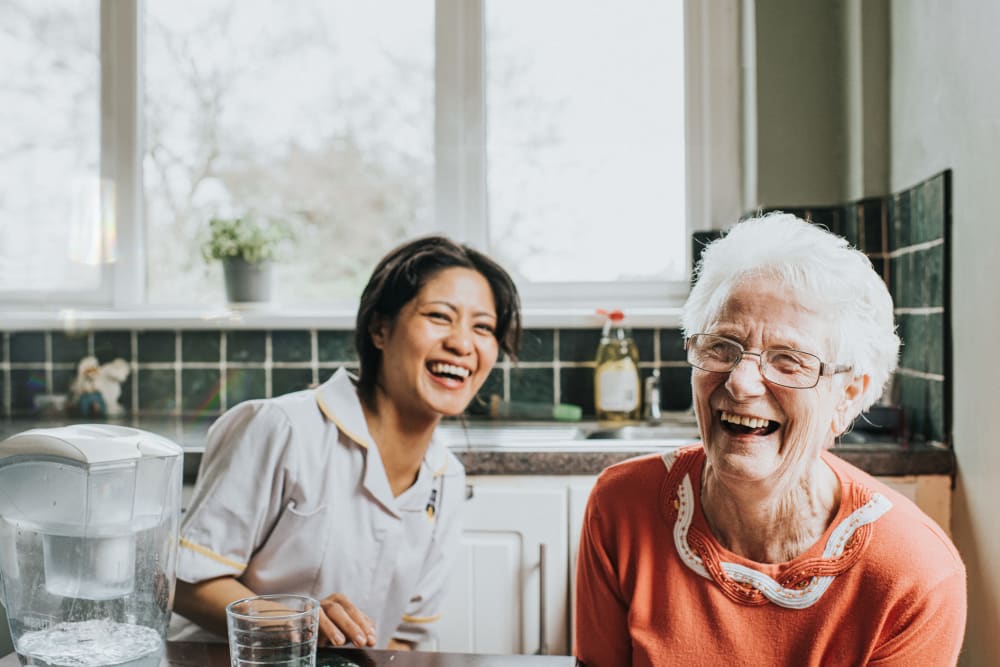 Women laughing at Creekside Village Senior Apartment Homes in Pittsburg, California