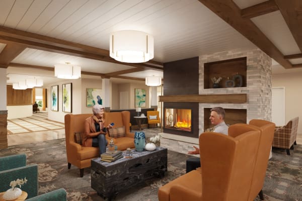 Residents enjoying the indoor fireplace at The Alexander in Bend, Oregon