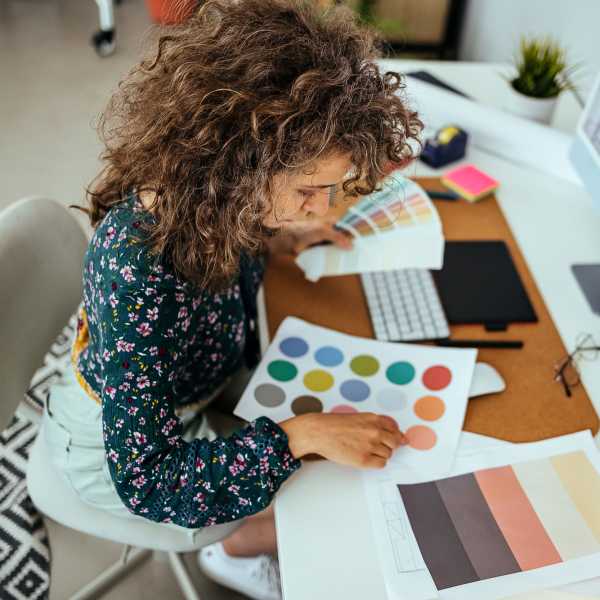 Designer doing color selection work at O'Brien Realty Group in Avon, Connecticut