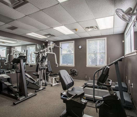 Fully equipped fitness center at Perinton Manor Apartments in Fairport, New York