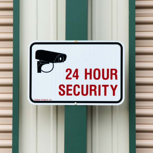 A sign for 24 hour security at Red Dot Storage in Antioch, Illinois