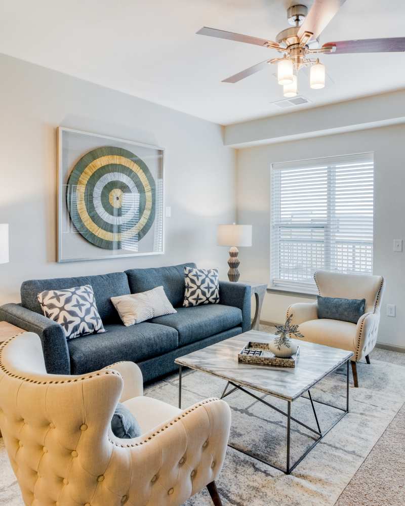 Living room with modern furniture at The Mark at Fishers District in Fishers, IN