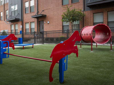 Agility equipment in the fenced onsite dog park at Steelyard in Oklahoma City, Oklahoma