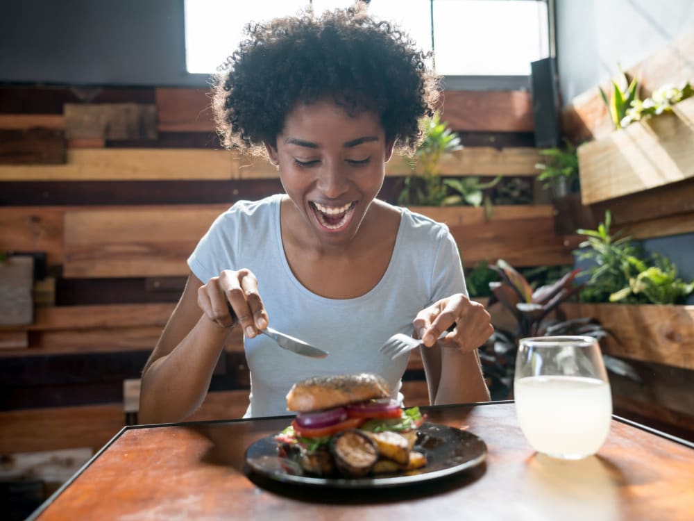 Woman enjoying some tasty food at TerraLane at Park McDowell in Phoenix, Arizona