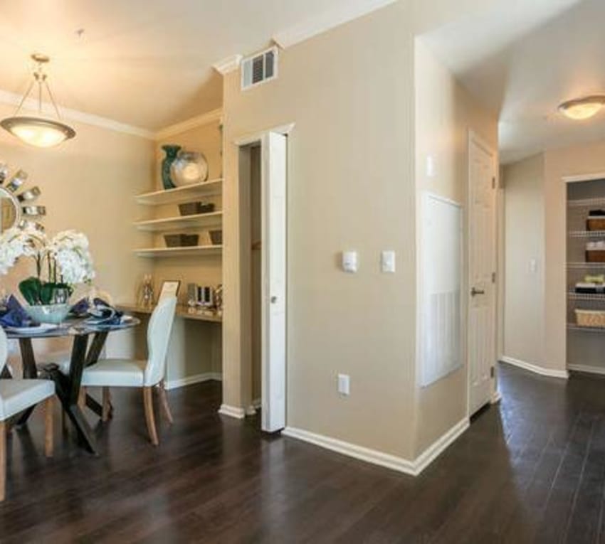 Dining table and hallway view of model at Westridge Apartments in Aurora, CO