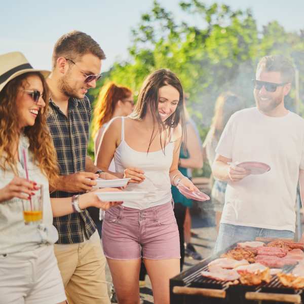 Friends enjoy a barbeque at The Plaza Taos, Chandler, Arizona