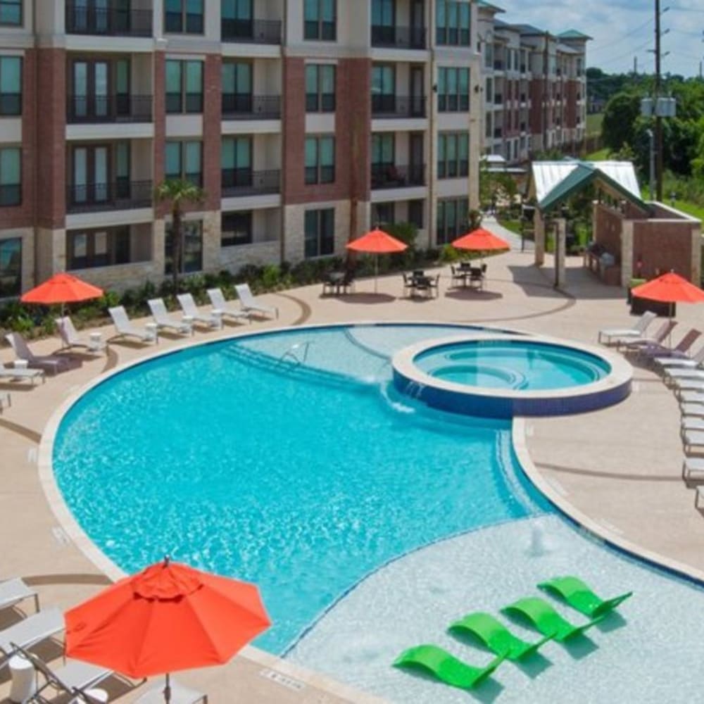 Aerial view of the resort-style swimming pool and sundeck at Imperial Lofts in Sugar Land, Texas