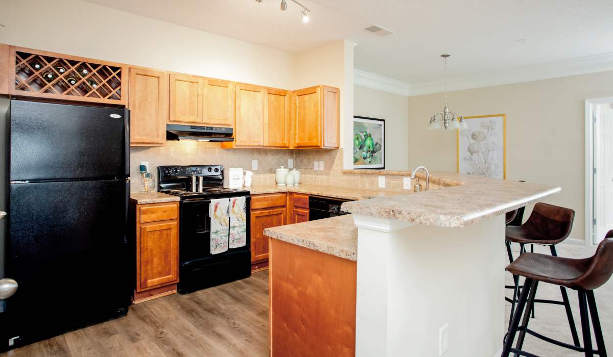 Kitchen with modern appliances and Island countertop at Madison Park in Madison, Alabama