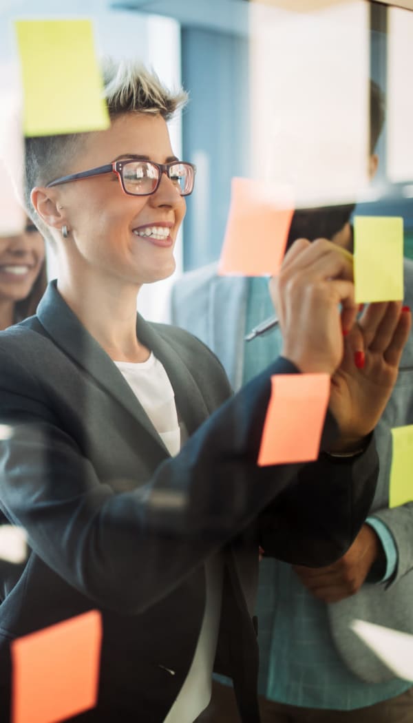 Employee writing notes at Ray Stone Inc.