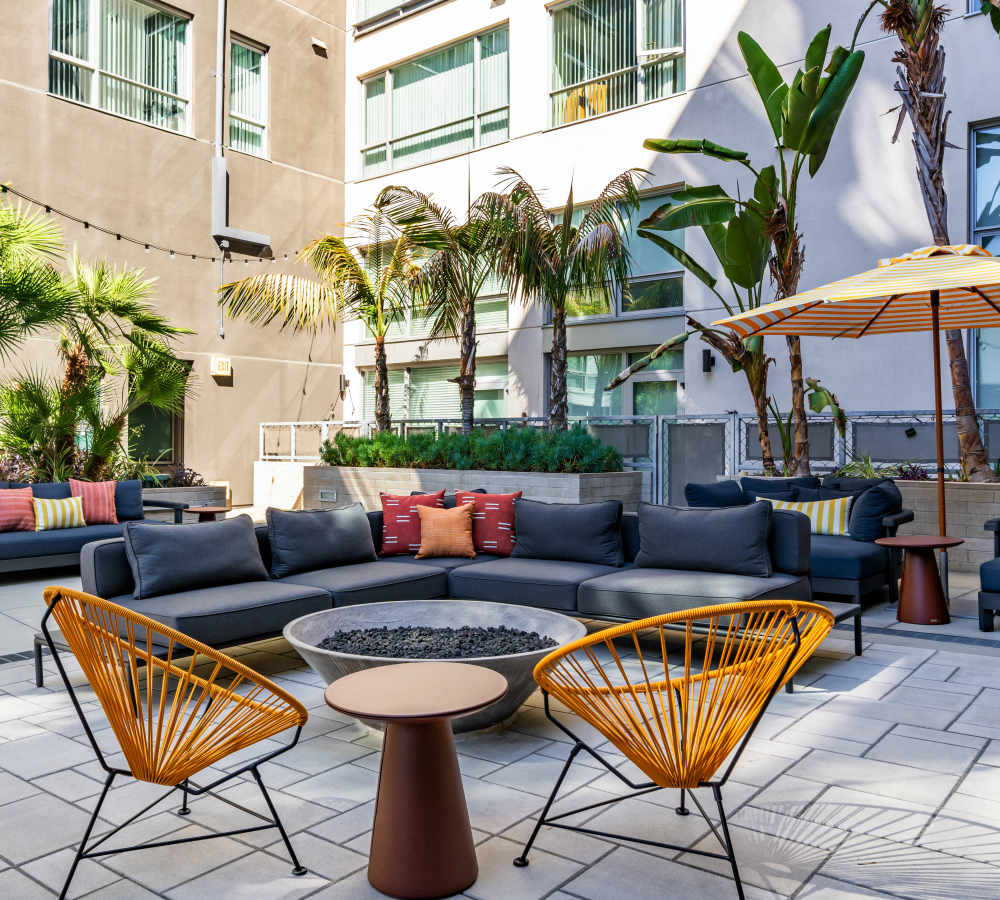 Outdoor sitting lounge at Nova Apartment Homes in San Diego, California