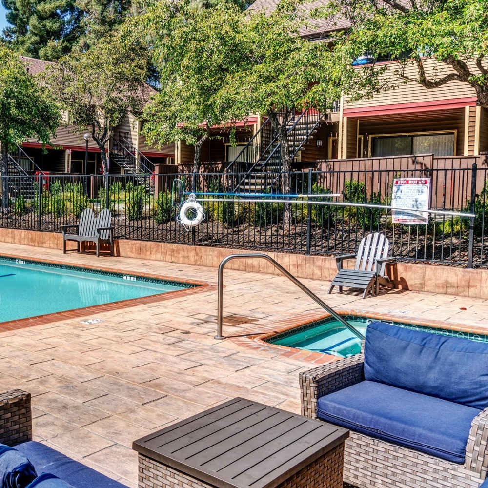 Pool with sundeck at Woodchase Apartments in San Leandro, California