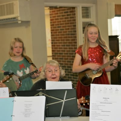 Residents and children playing music at Ebenezer Ridges Campus in Burnsville, Minnesota