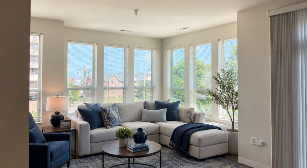 A well-lit living room with two sofas at 5th Avenue Lofts in Kenosha, Wisconsin