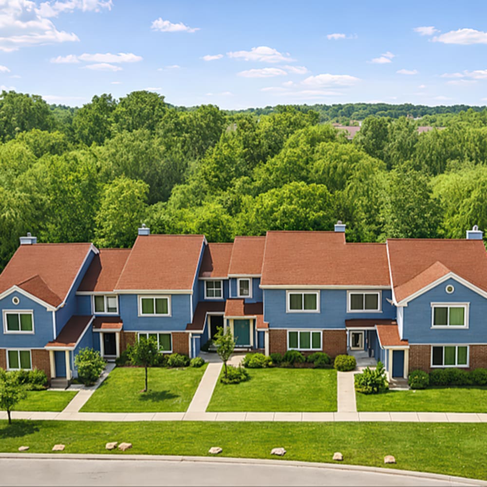 Townhomes with green landscaping at 83 West Townhomes in West Bloomfield Township, Michigan