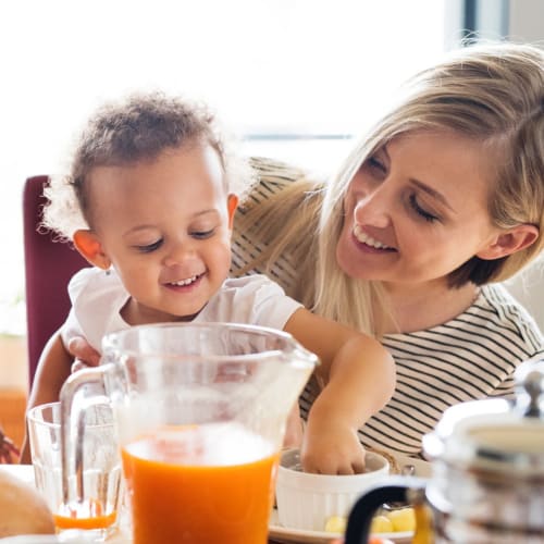 A mother and child eating breakfast at Shelton Circle in Virginia Beach, Virginia