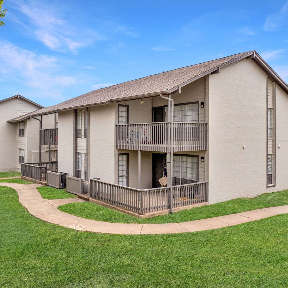 Bench and poolside at Woodlands of Plano in Plano, Texas