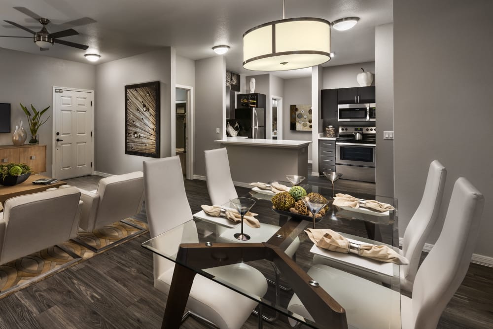 Spacious kitchen overlooking the living room in a model home at Avenue 25 in Phoenix, Arizona