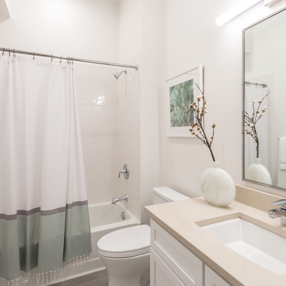 Model bathroom with tile shower at Metro Green Court in Stamford, Connecticut