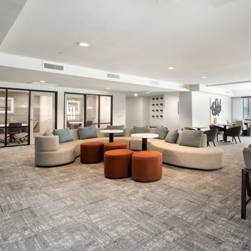 Community clubhouse with several sitting couches at Marquis at Chandler in Chandler, Arizona