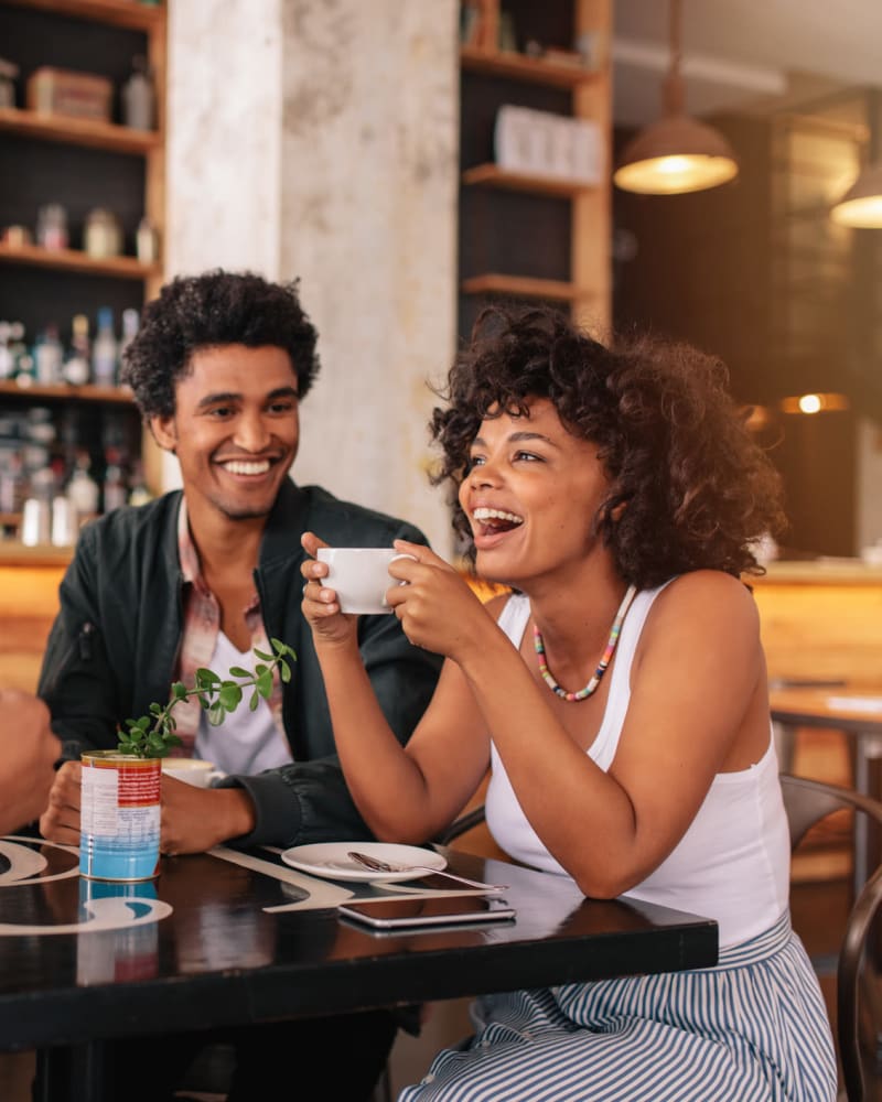 Friends enjoying coffee near Bluebird Row in Chattanooga, Tennessee