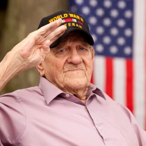 WWII veteran saluting at Oxford Vista Wichita in Wichita, Kansas