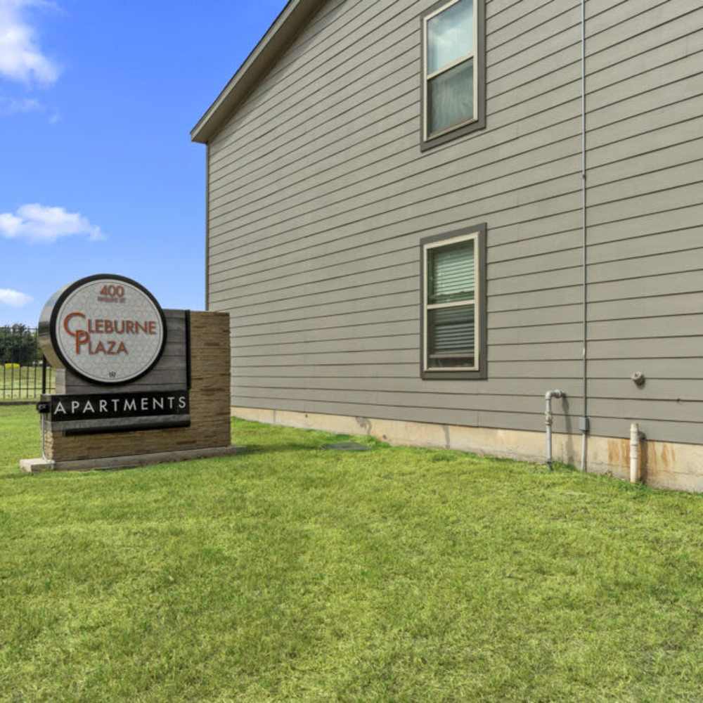 Exterior with property signage board at Cleburne Plaza in Cleburne, Texas