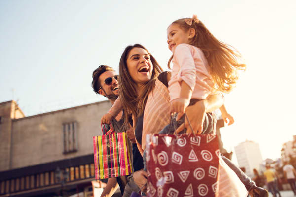 A mother and father out shopping with their child near Hamlet at MidCity in Huntsville, Alabama