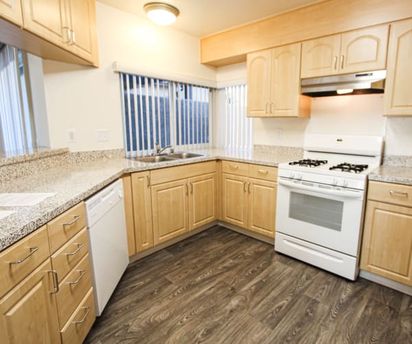 A kitchen with a dishwasher at Woodlake in Lakeside, California