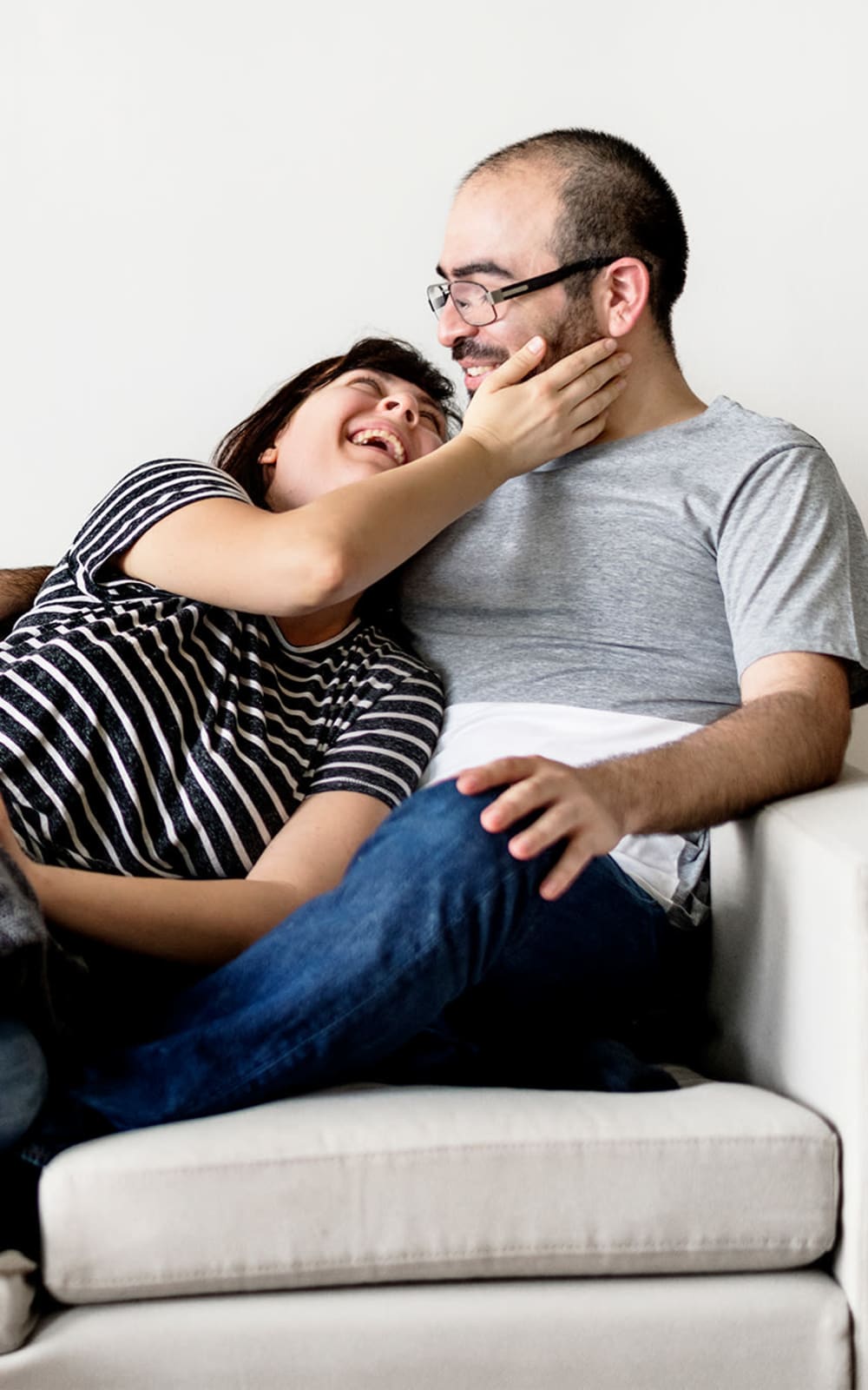 Resident couple laughing in their home at Vital at Springbrook in Alcoa, Tennessee