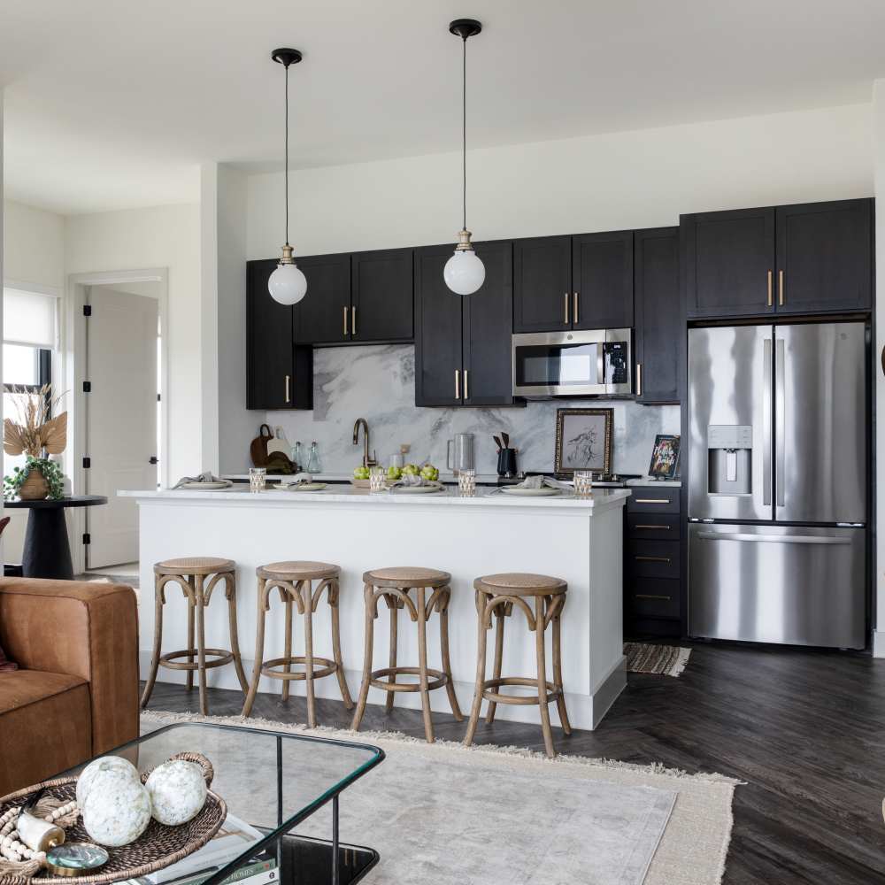 Kitchen with modern appliances at Katy Trail Uptown in Dallas, Texas