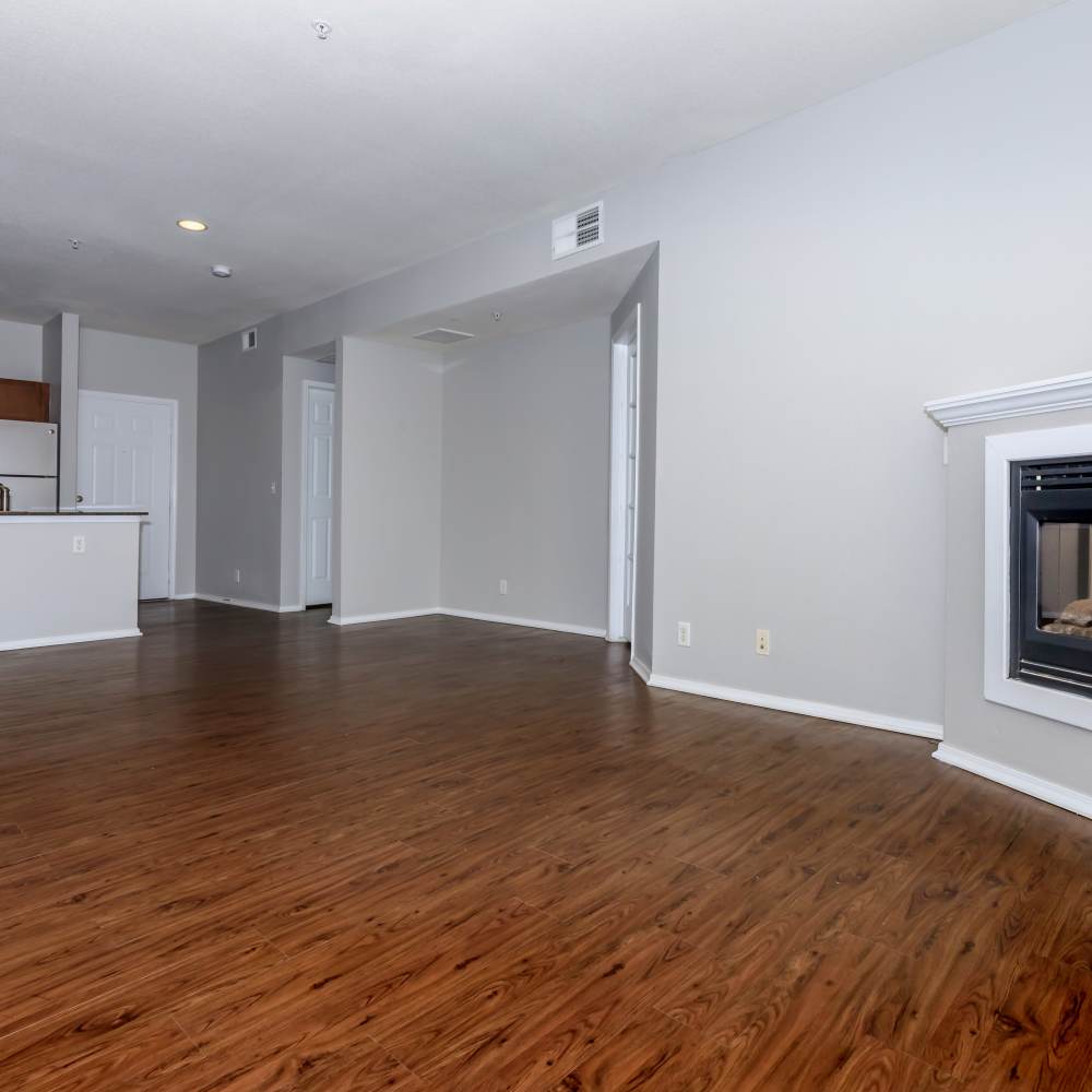 Unfurnished living room with wood-style flooring at One Belmar Place in Lakewood,Colorado