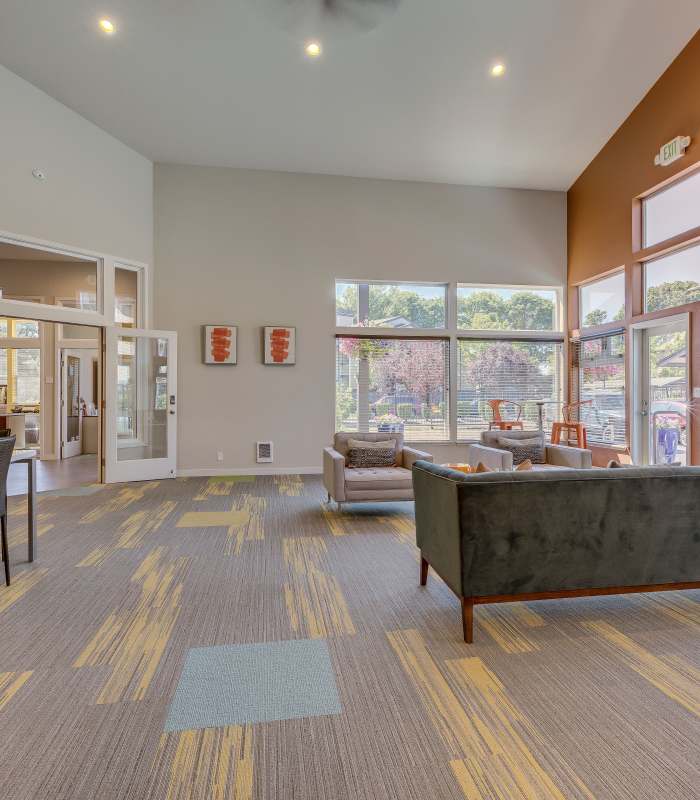Indoor lounge with couch at Foundry on Fifth in Renton, Washington
