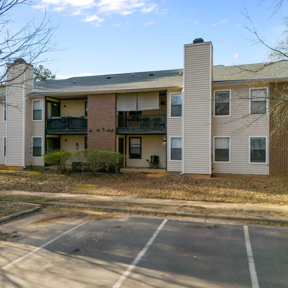 Front view of the apartment with parking lots at Bryan Woods in Garner, North Carolina