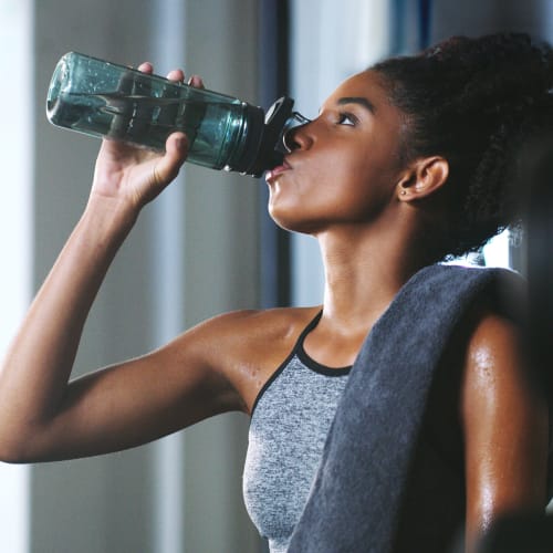 Resident hydrating after a good workout in the professional-quality fitness center at Solaire 8200 Dixon in Silver Spring, Maryland