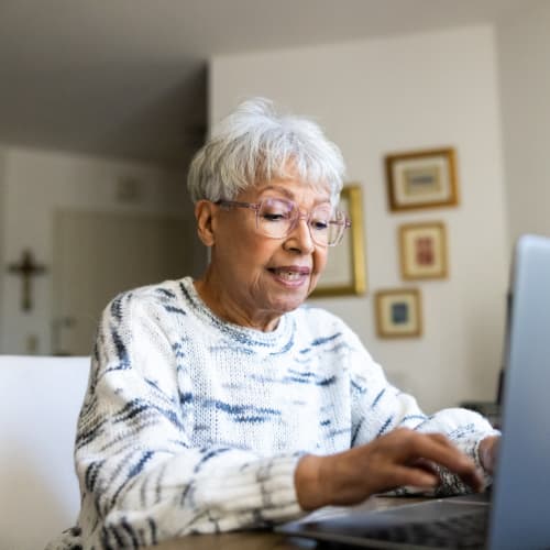 Woman using her laptop at Oxford Vista Wichita in Wichita, Kansas