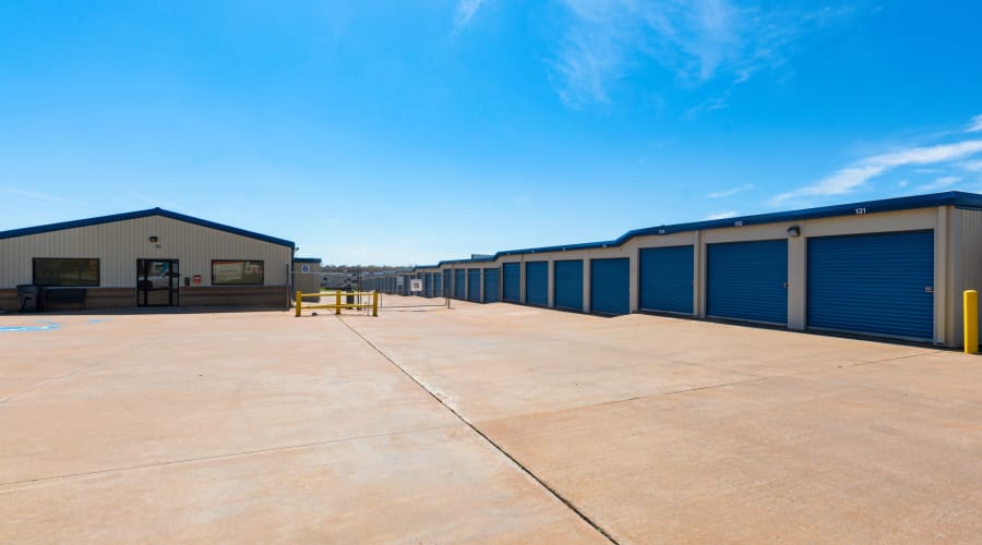 Exterior view of storage units with blue doors at KO Storage in Wichita Falls, Texas