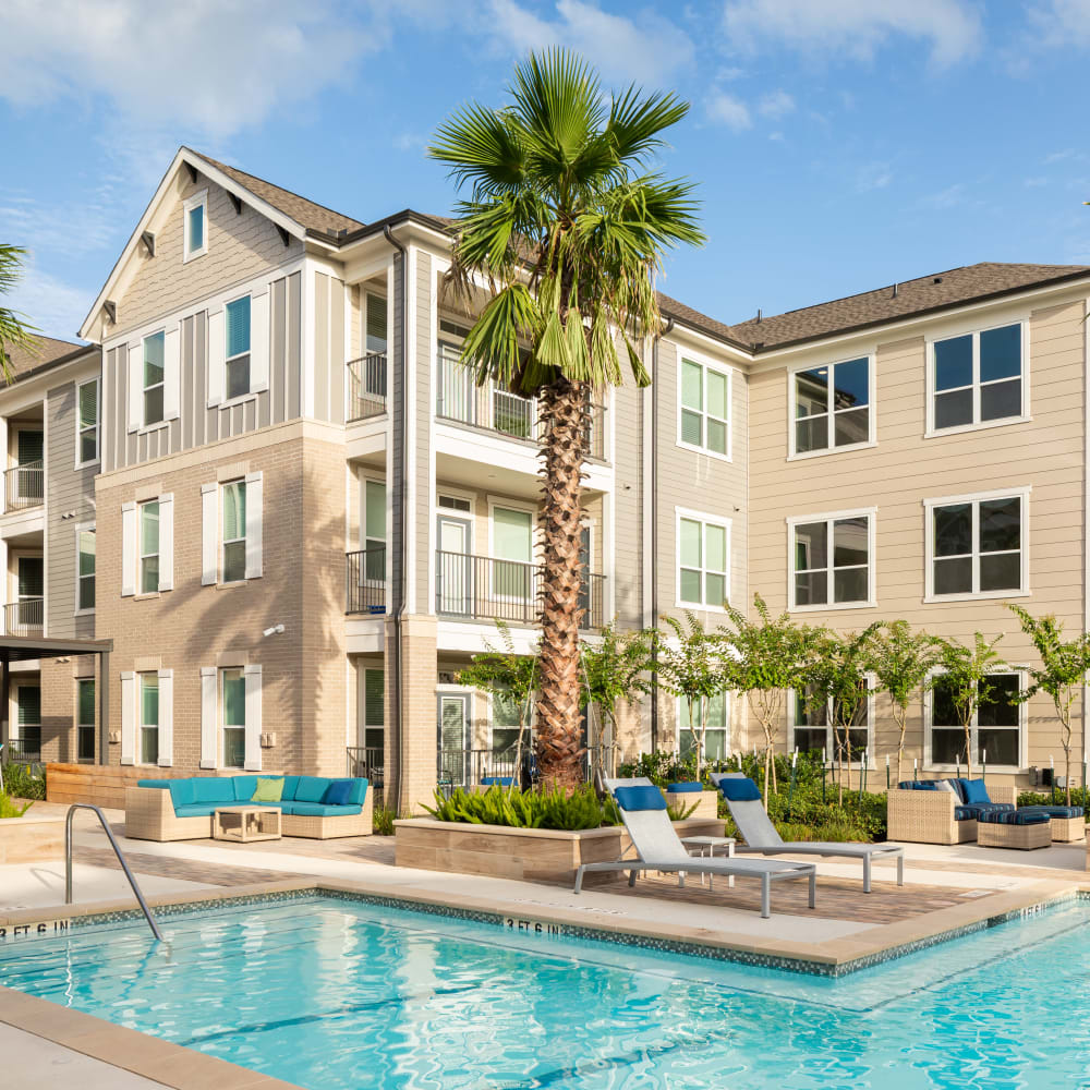 Exterior and community pool at Bellrock Market Station in Katy, Texas