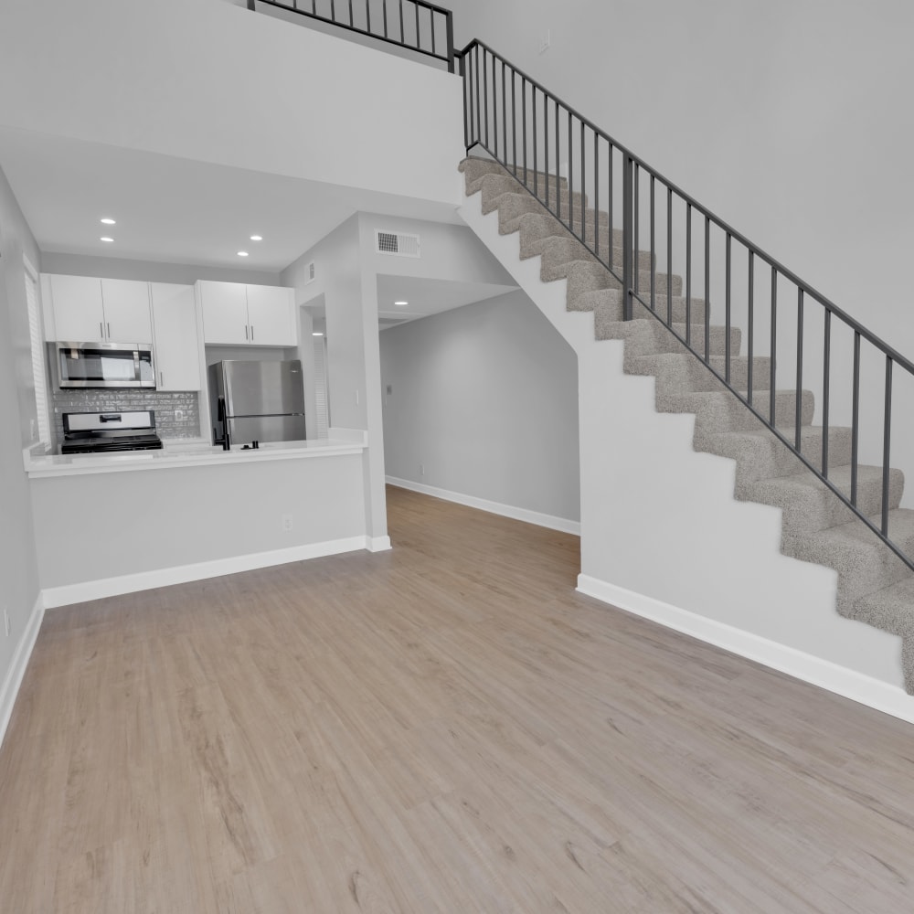 Minimalist-style apartment with wood-style flooring at The Tower at Hollywood Hills, Los Angeles, California