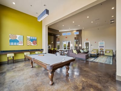 Brightly decorated game room and pool table at The BLVD in San Angelo, Texas