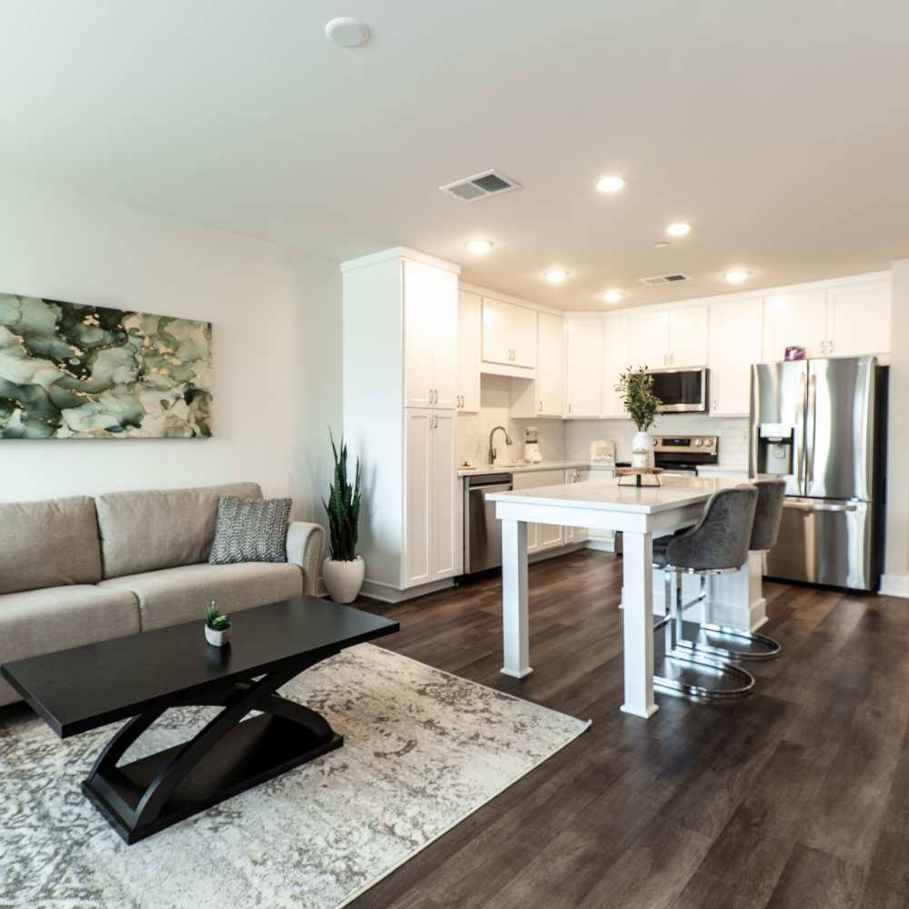Spacious living area with access to open kitchen at The Cove, Port St Lucie, Florida