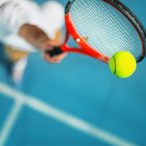 A resident playing tennis at South Mesa II in Oceanside, California