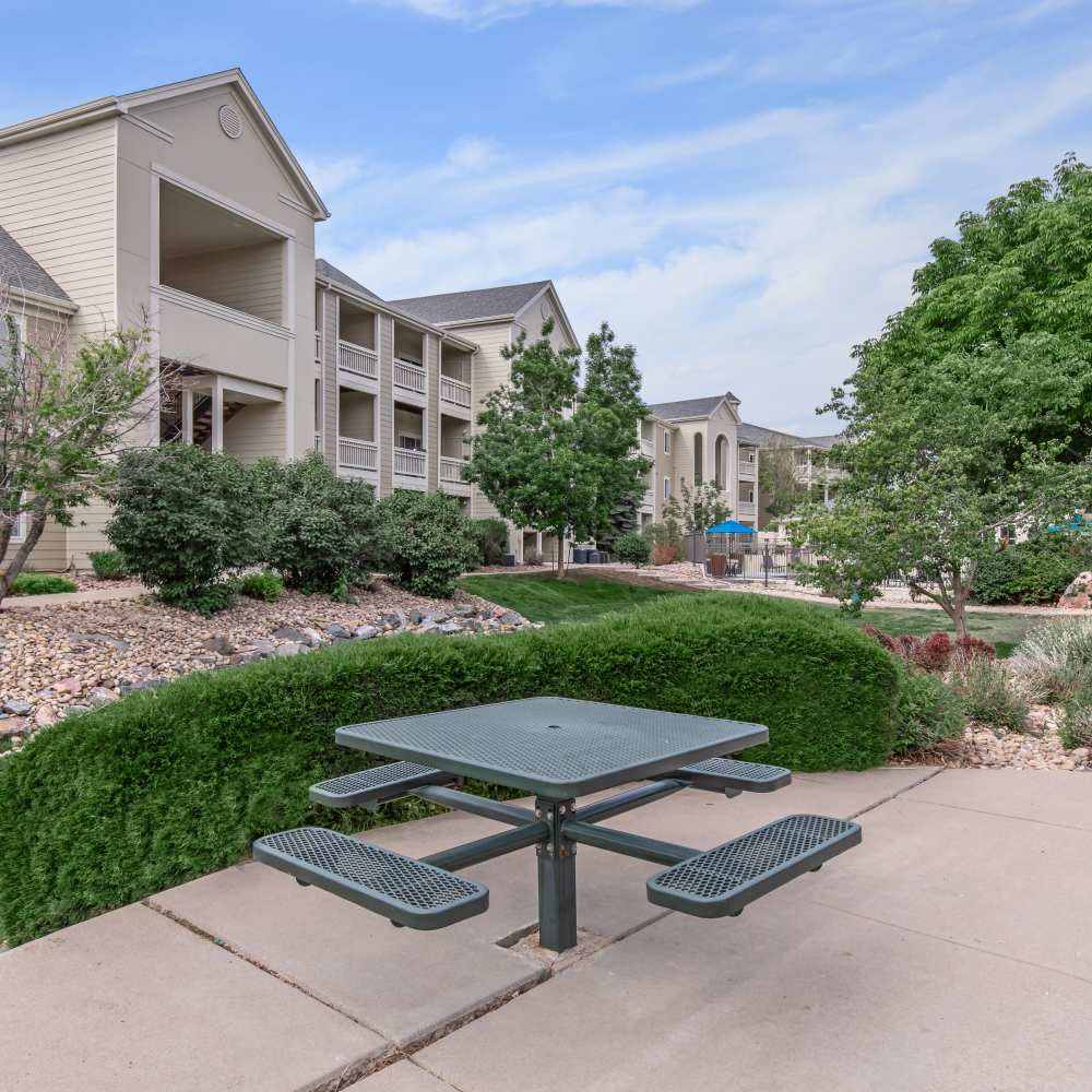 Outdoor seating with community view at One Belmar Place in Lakewood, Colorado
