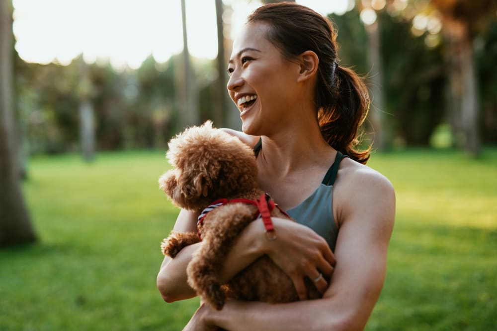 Woman with dog at The Everstead at Madison in Madison, Alabama