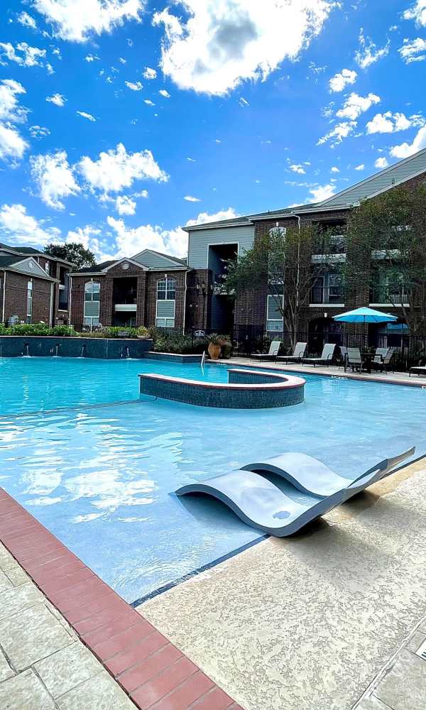 Sparkling swimming pool at The Abbey at Barker Cypress in Houston, Texas