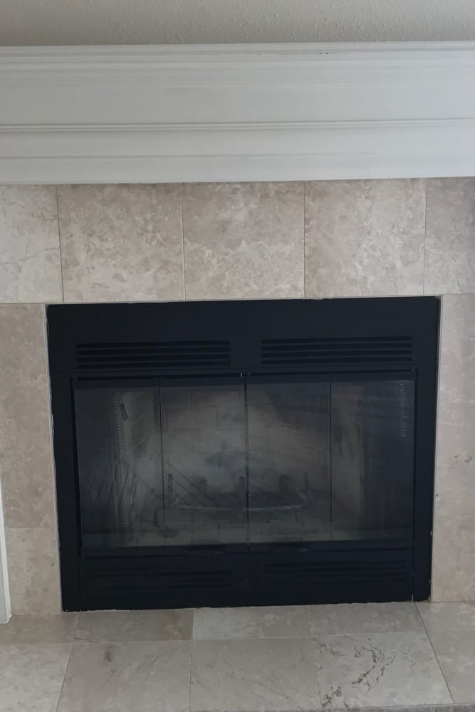 Living space with fireplace at Lakeshore Apartment Homes in Evansville, Indiana