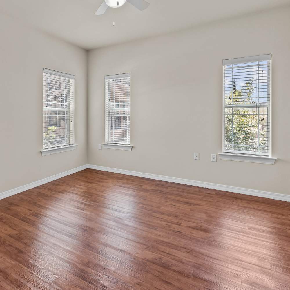 Bedroom with multiple windows at Las Torres Apartments in El Paso, Texas