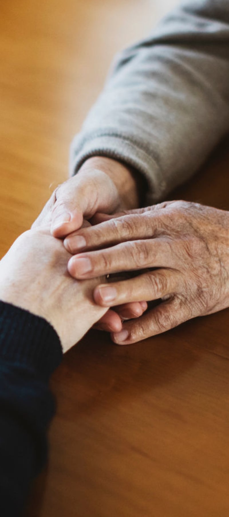 Residents sitting and talking with the help of a caretaker at Maple Ridge Care Center in Spooner, Wisconsin