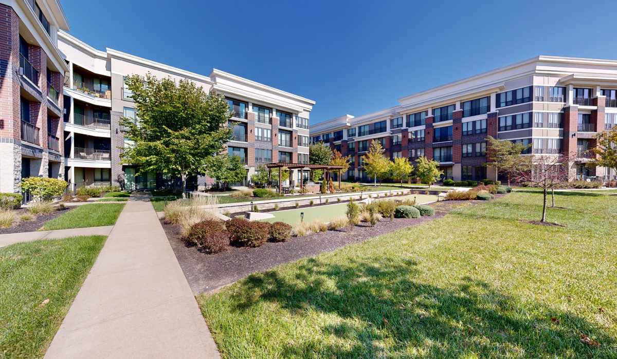Grassy walking path with trees surrounding at Latitude at Deerfield Crossing in Mason, Ohio