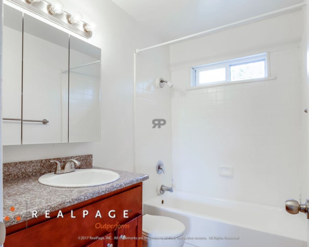 Model bathroom with granite countertops at Washington Townhomes in San Lorenzo, California